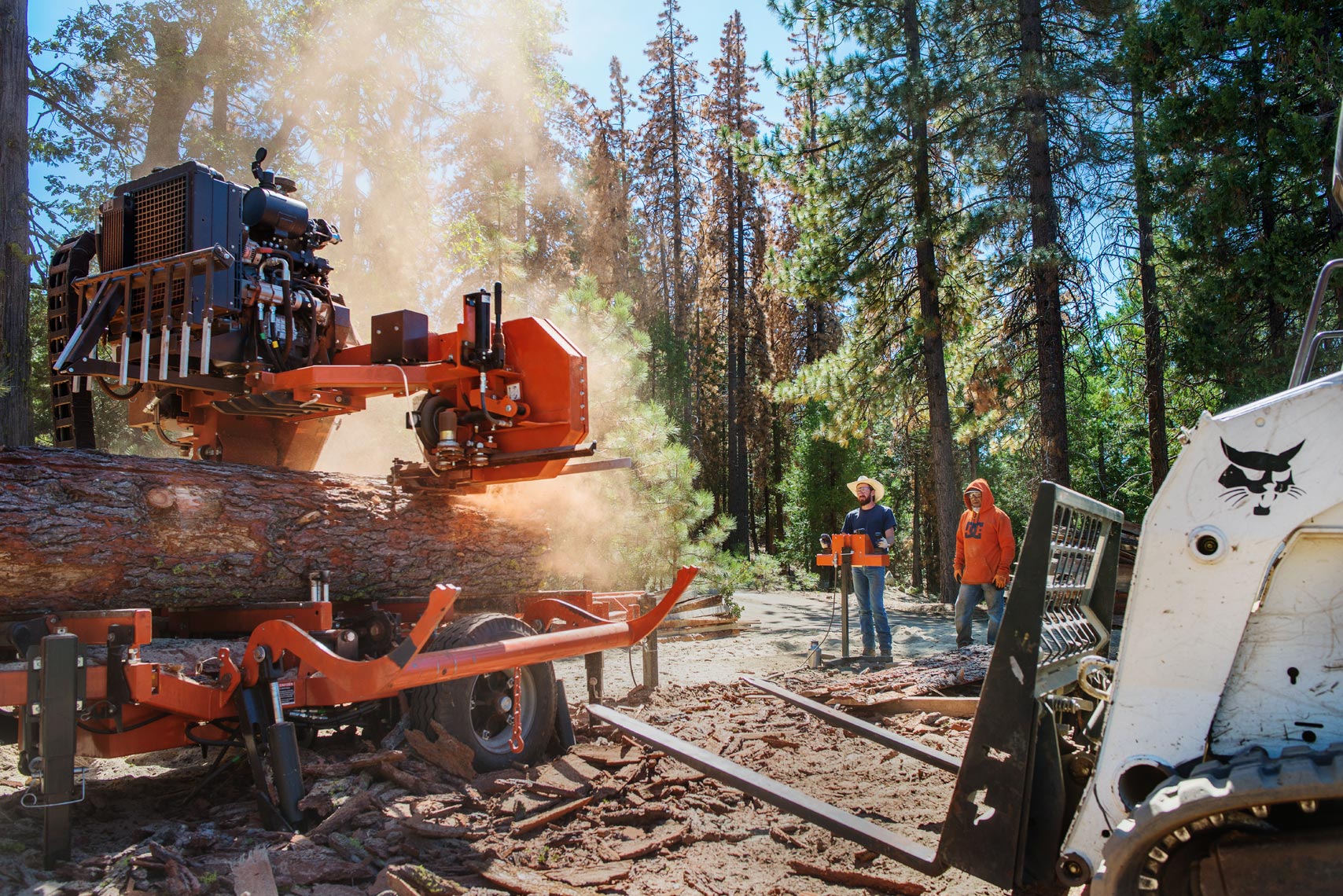 Woodmizer sawing through fresh cut logs